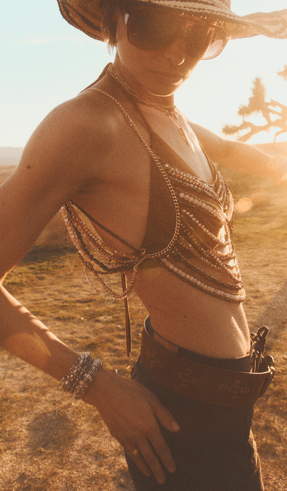 a model wearing a jeweled top