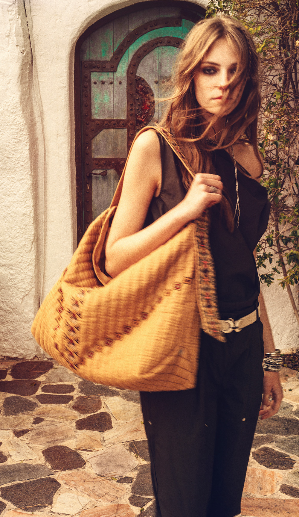 a model wearing a quilted giant totebag