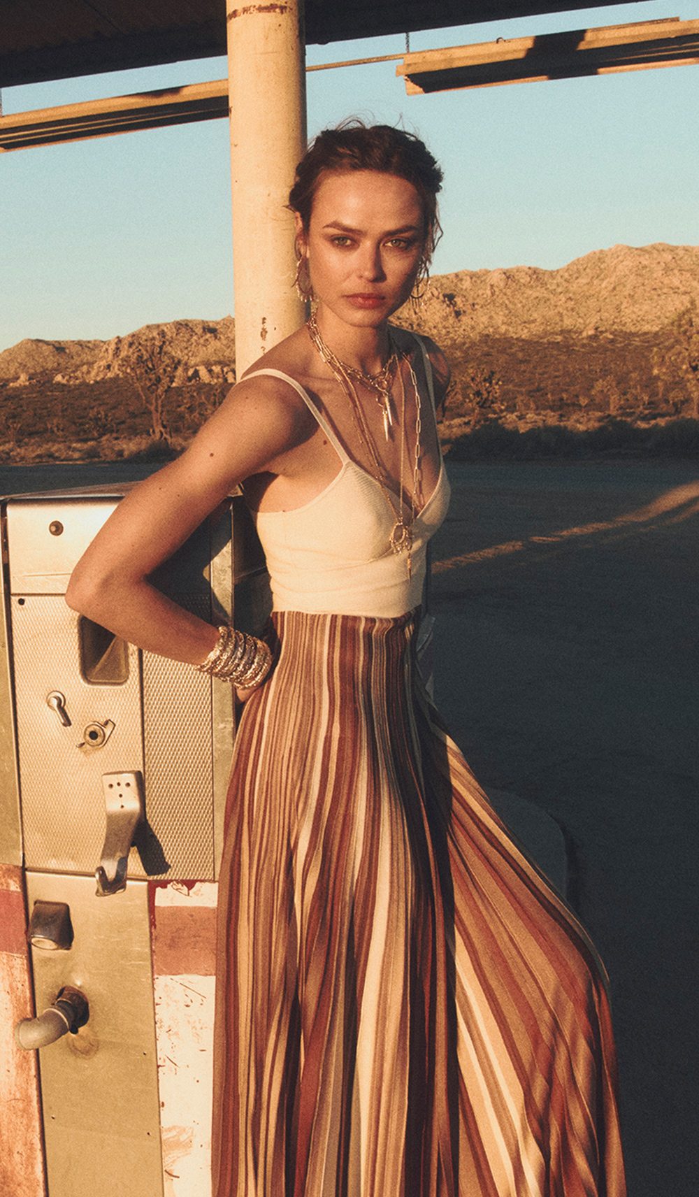 a model standing wearing a various colors dress
