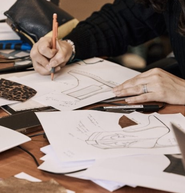 Designer drawing a pair of coda boots